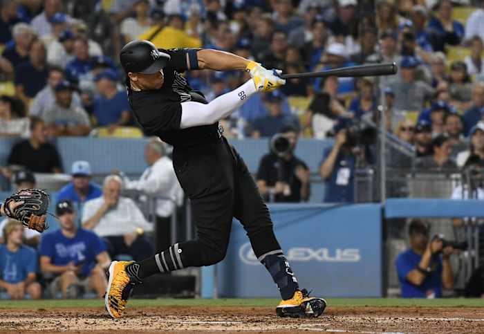 Aug 23, 2019; Los Angeles, CA, USA; New York Yankees right fielder Aaron Judge (99) hits a solo home run in the third inning against the Los Angeles Dodgers during an MLB Players' Weekend game at Dodger Stadium. Mandatory Credit: Richard Mackson-USA TODAY Sports